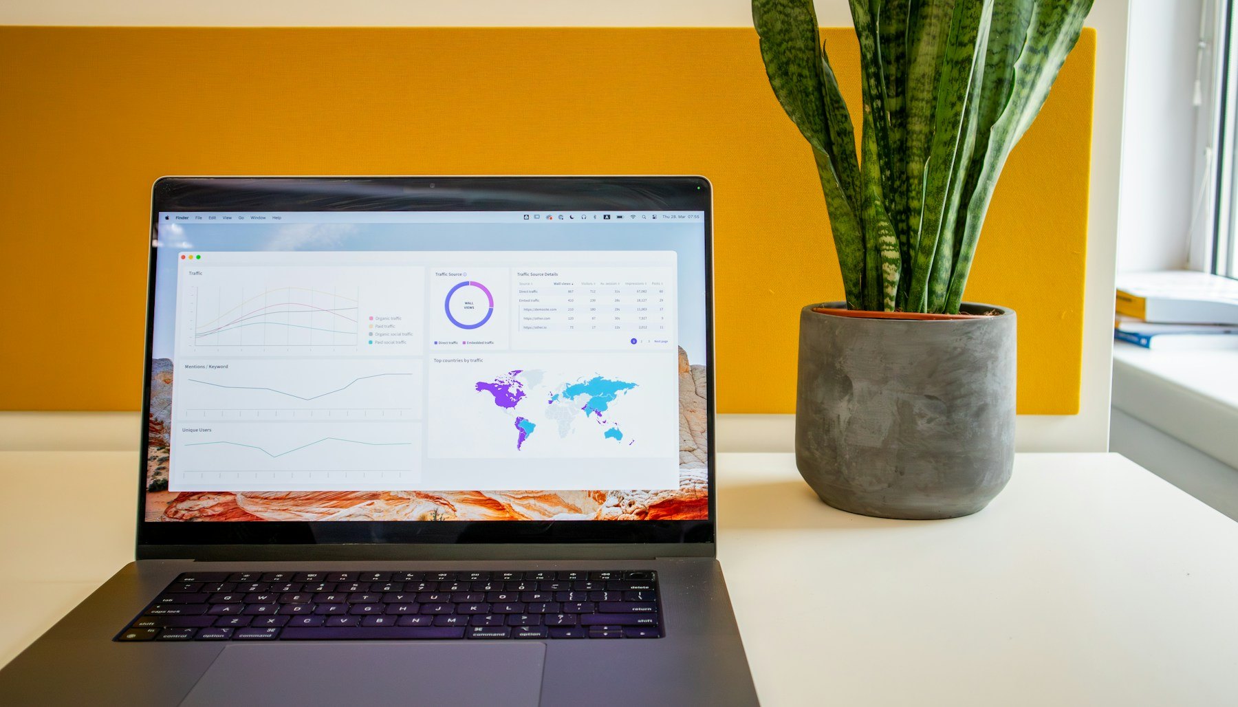 Laptop and marketing planning workspace